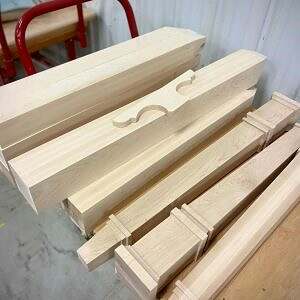 Square wood legs and decorative bun foot for a cabinet company