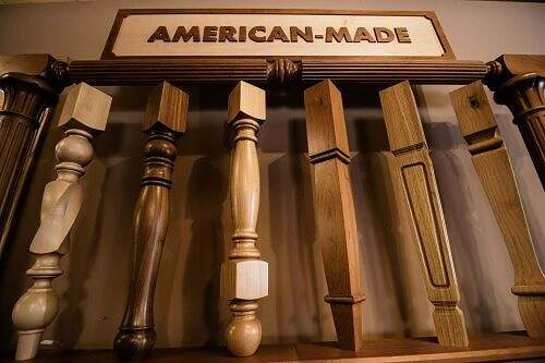 custom wood sign stating "American-Made" above custom turned and square wood legs