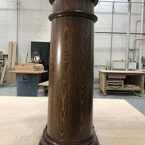 Custom turned wood bar column in wood shop